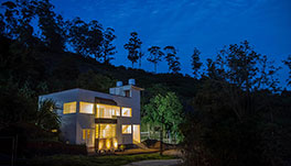 Petra Family Guest House, Valparai- Front View at Night -1